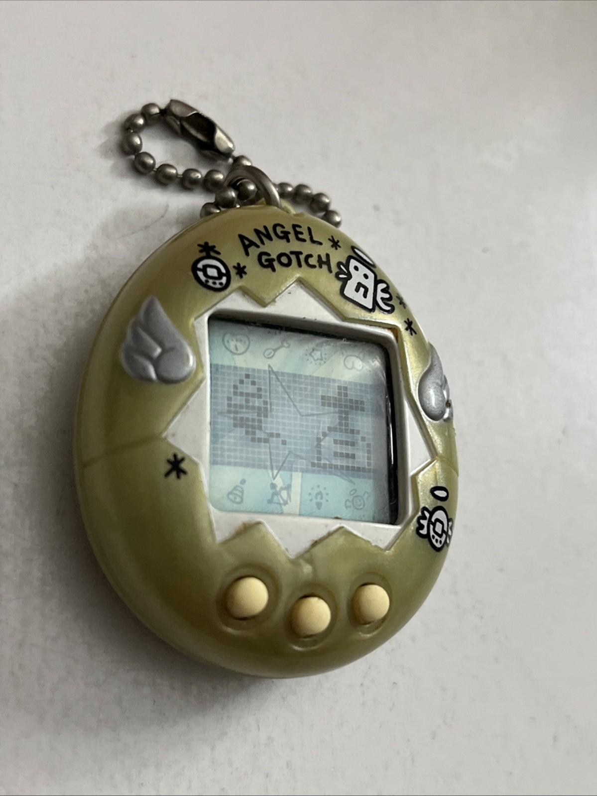 Bandai Tamagotchi Angel Gotch Portable Electronic Game Pearl 1997