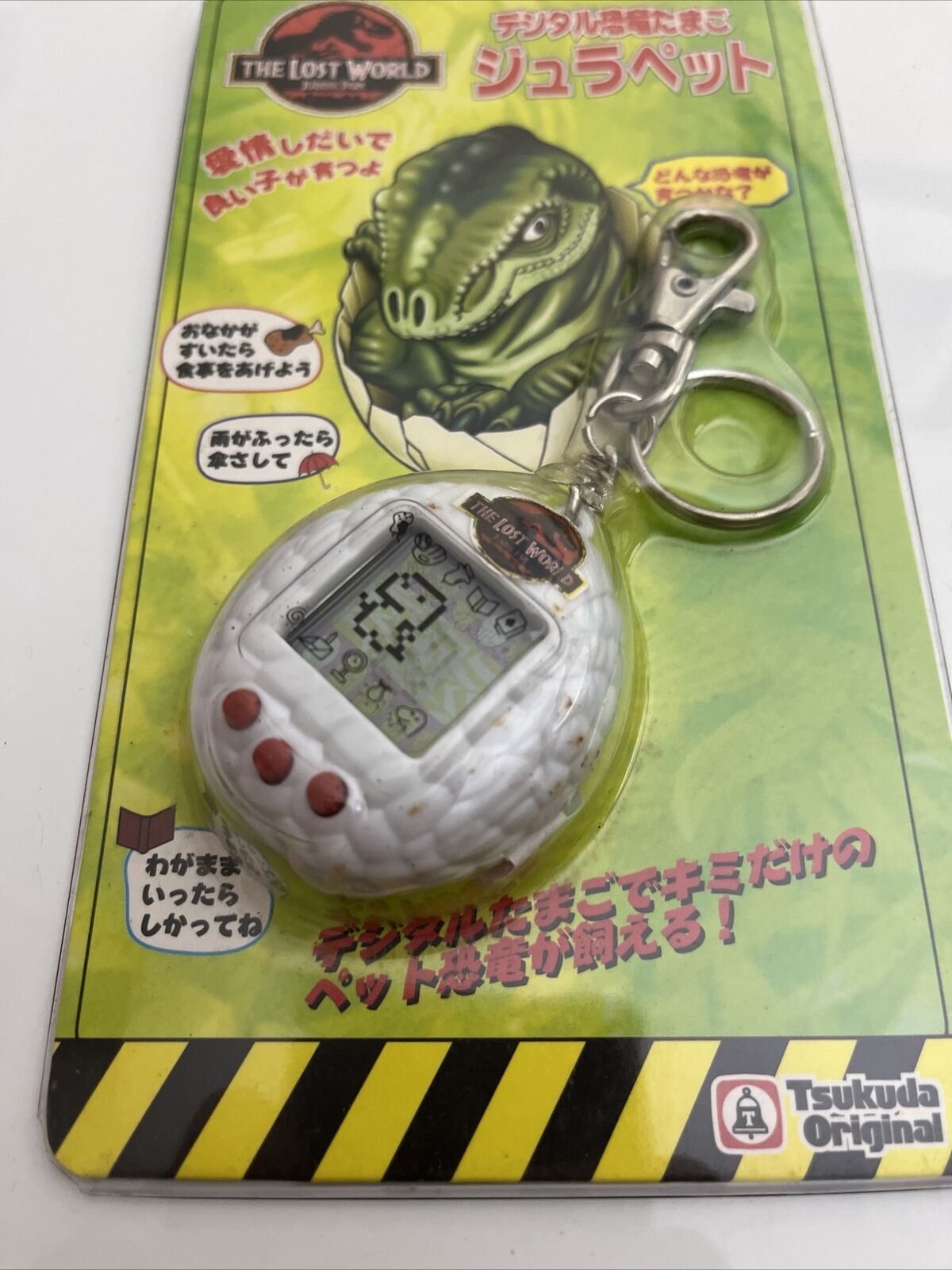 Jurassic Park The Lost World Tamagotchi Jura Pet White 1997 Electronic Pet NEW