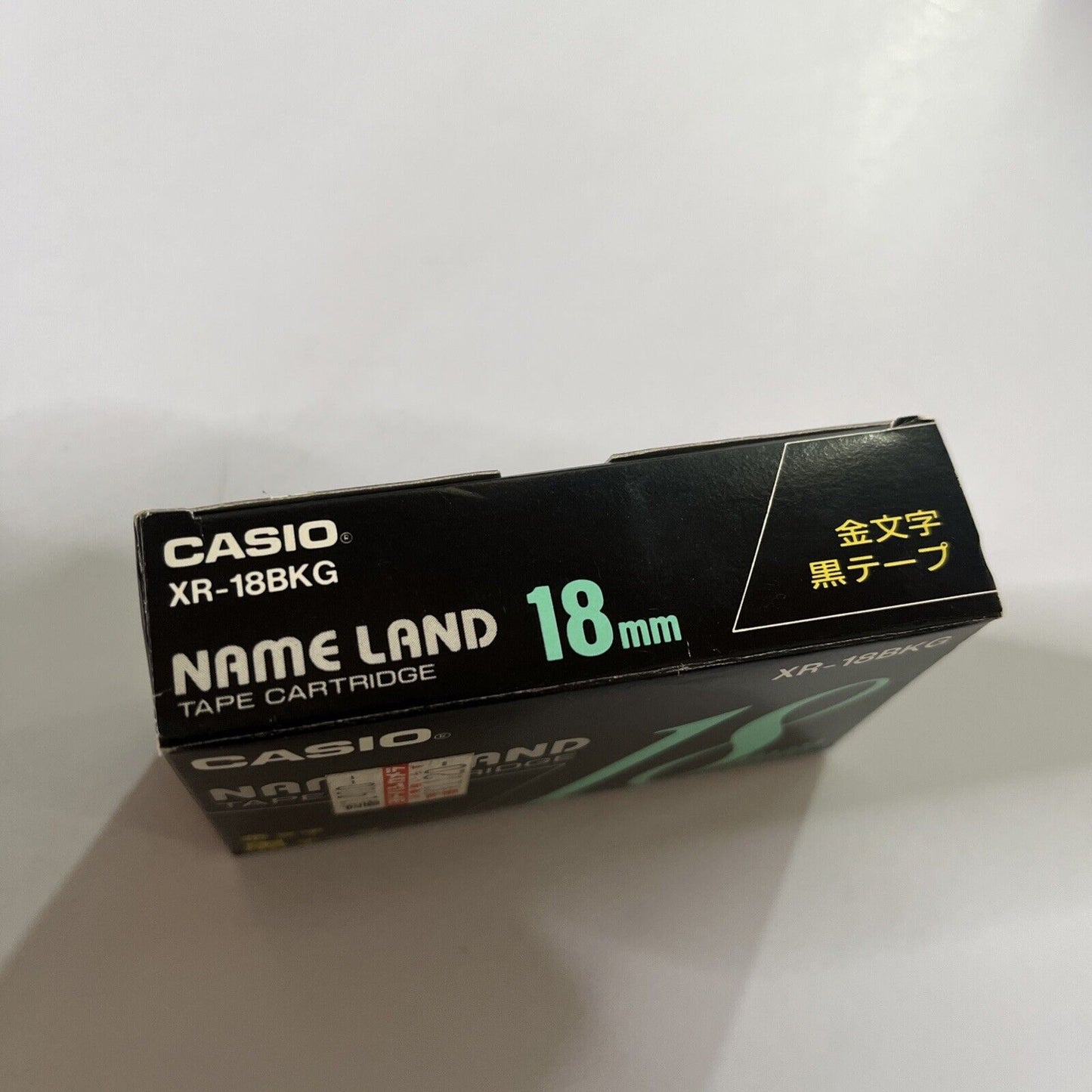 Casio Name Land Tape Cartridge 18mm Black Background Gold Text XR-18BKG NEW