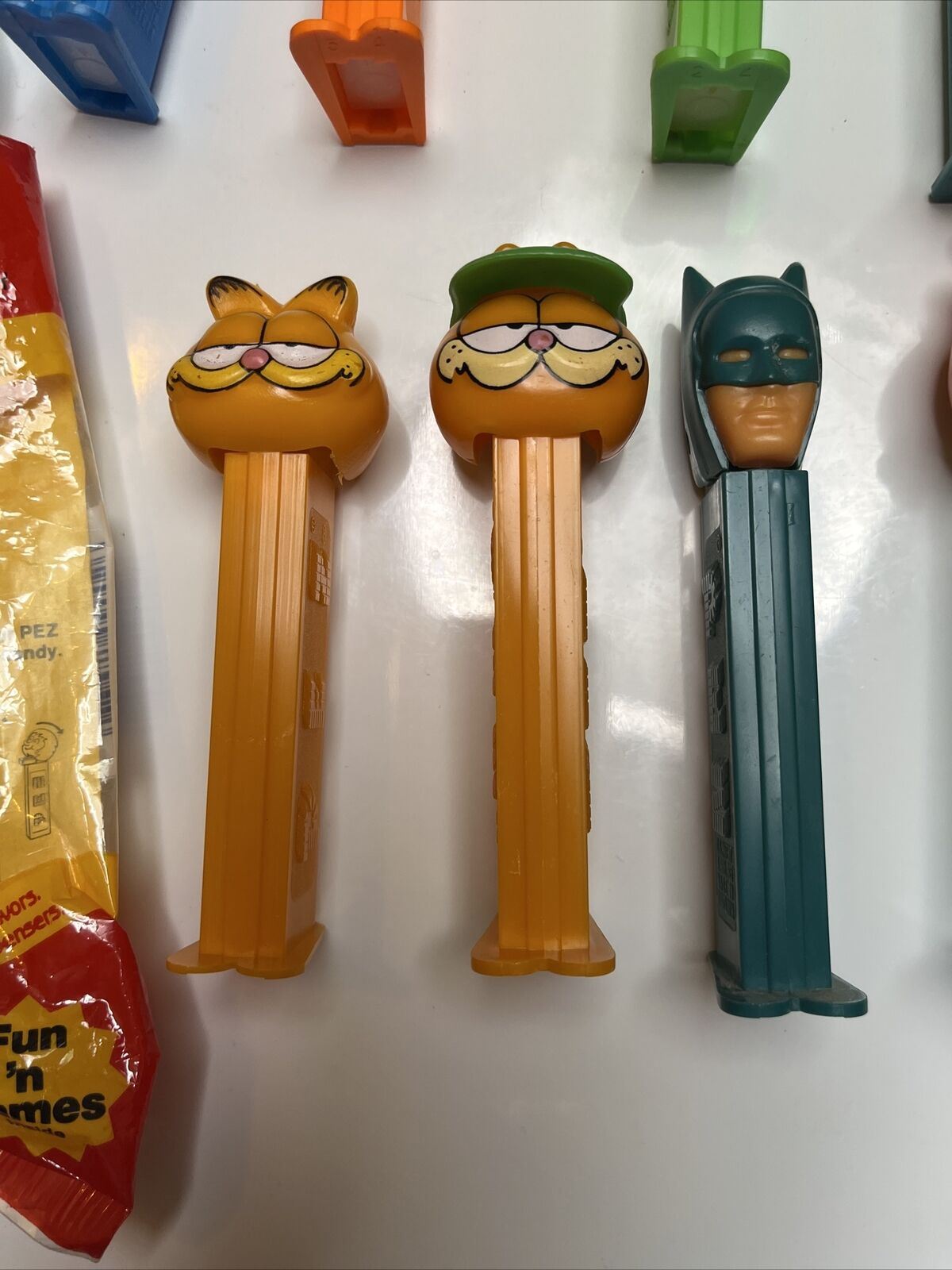 11x Pez Dispensers: Garfield, Batman, Barney, Pebbles, Tyke, The Ant & Aardvark