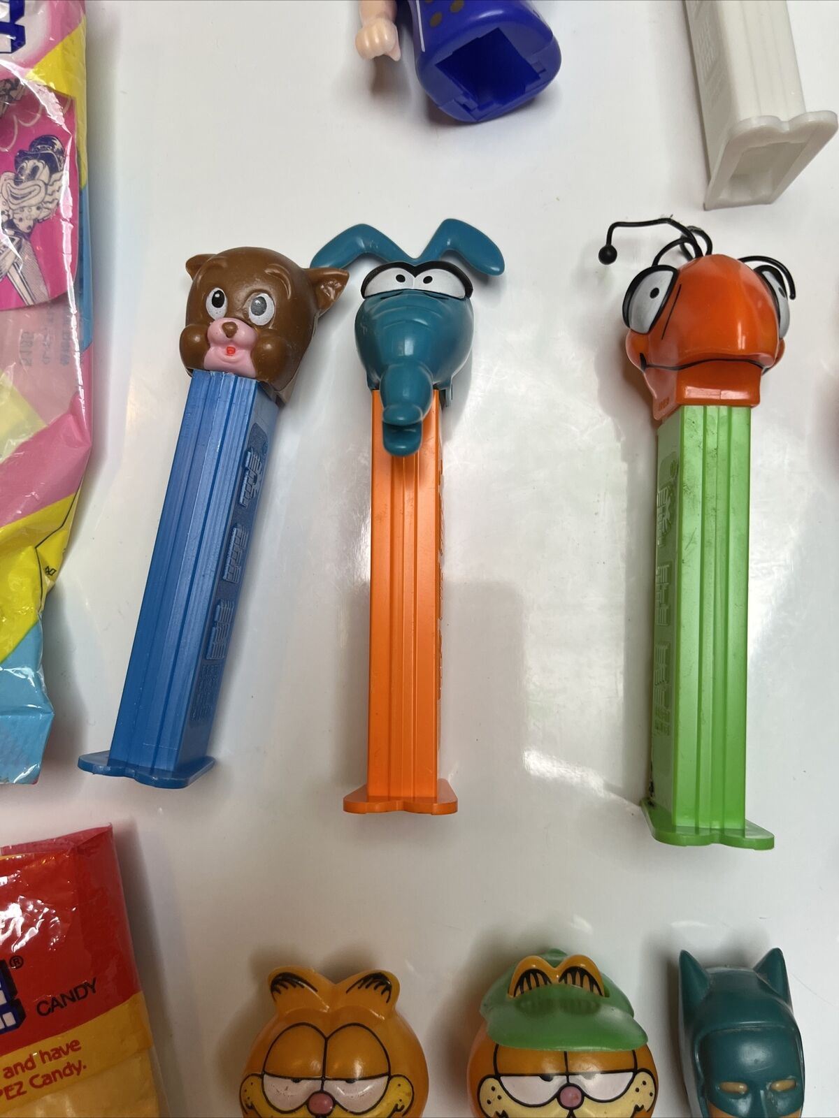 11x Pez Dispensers: Garfield, Batman, Barney, Pebbles, Tyke, The Ant & Aardvark