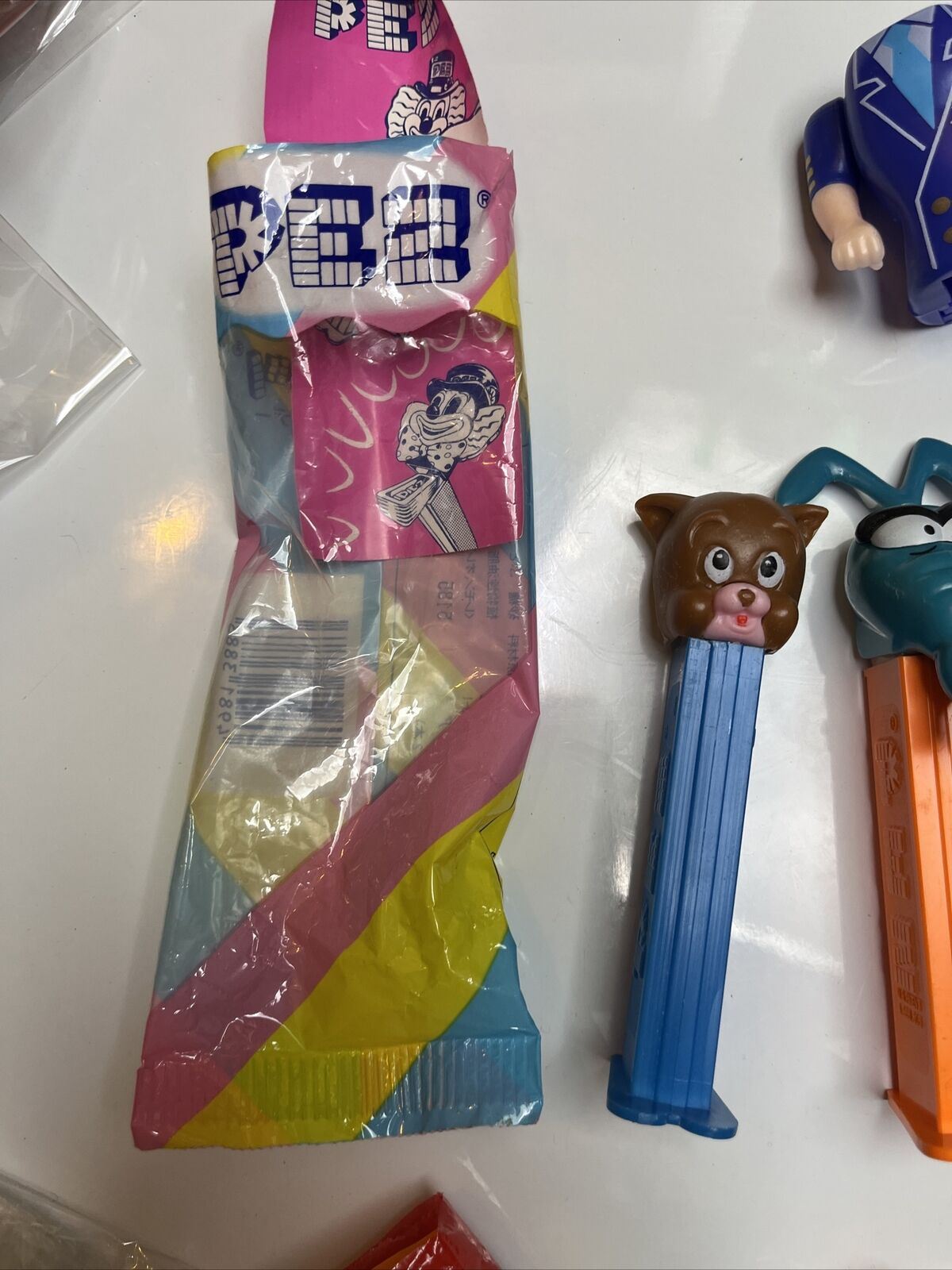 11x Pez Dispensers: Garfield, Batman, Barney, Pebbles, Tyke, The Ant & Aardvark