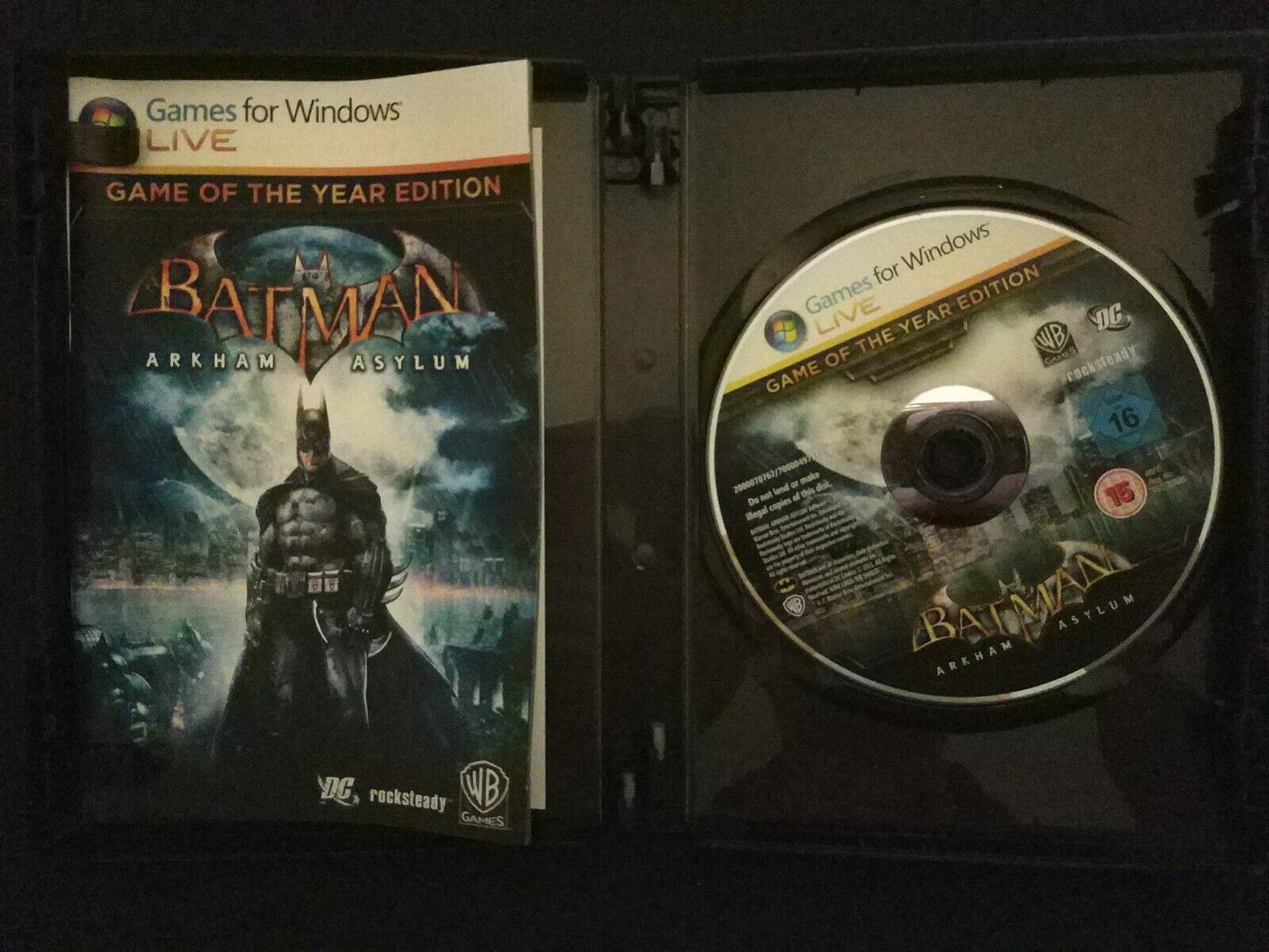 JUSTICE LEAGUE BATMAN: ARKHAM ASYLUM GAME OF THE YEAR EDITION PC GAMES DVD