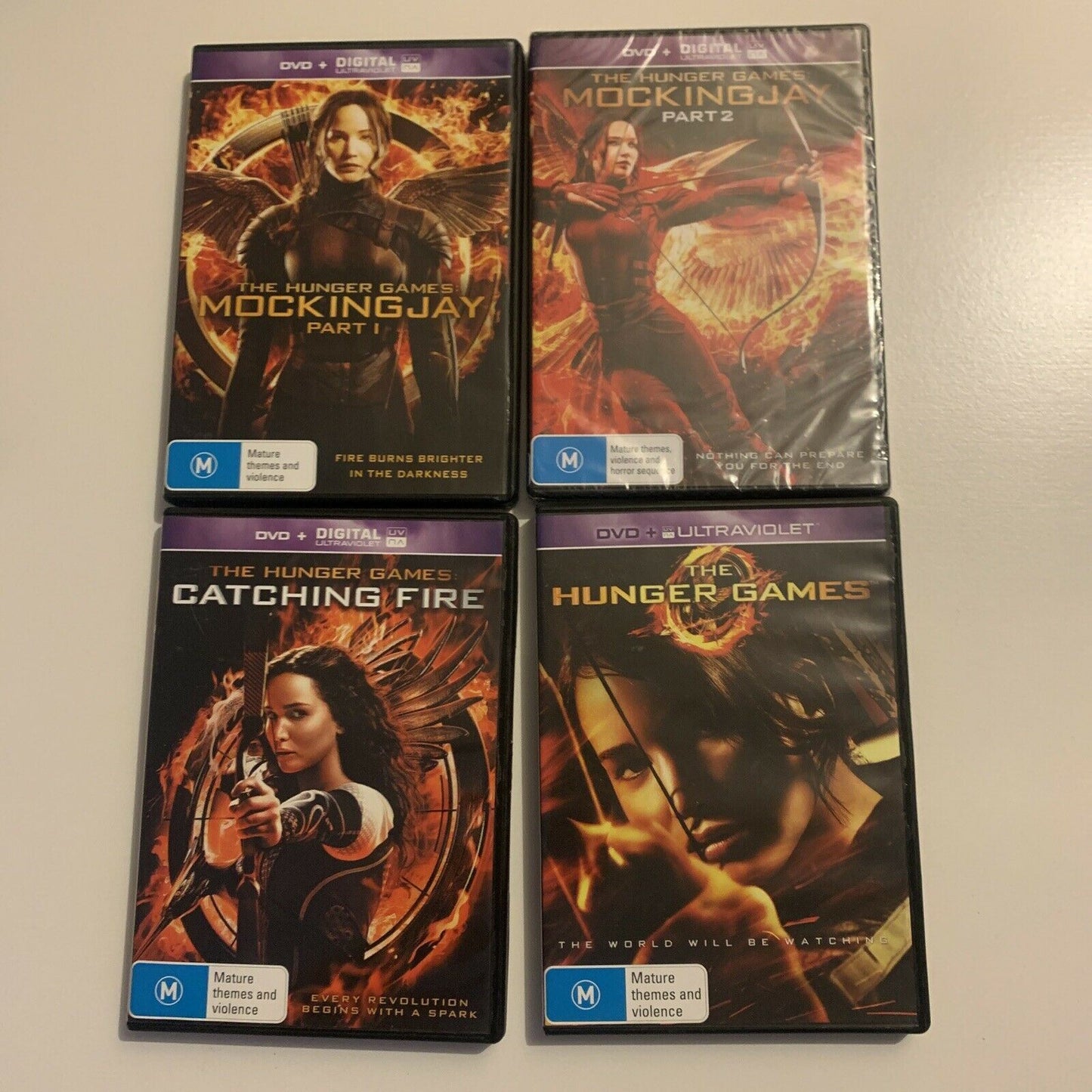 The Hunger Games / Catching Fire / Mockingjay Part 1 & 2 (DVD, 2015, 4-Disc)