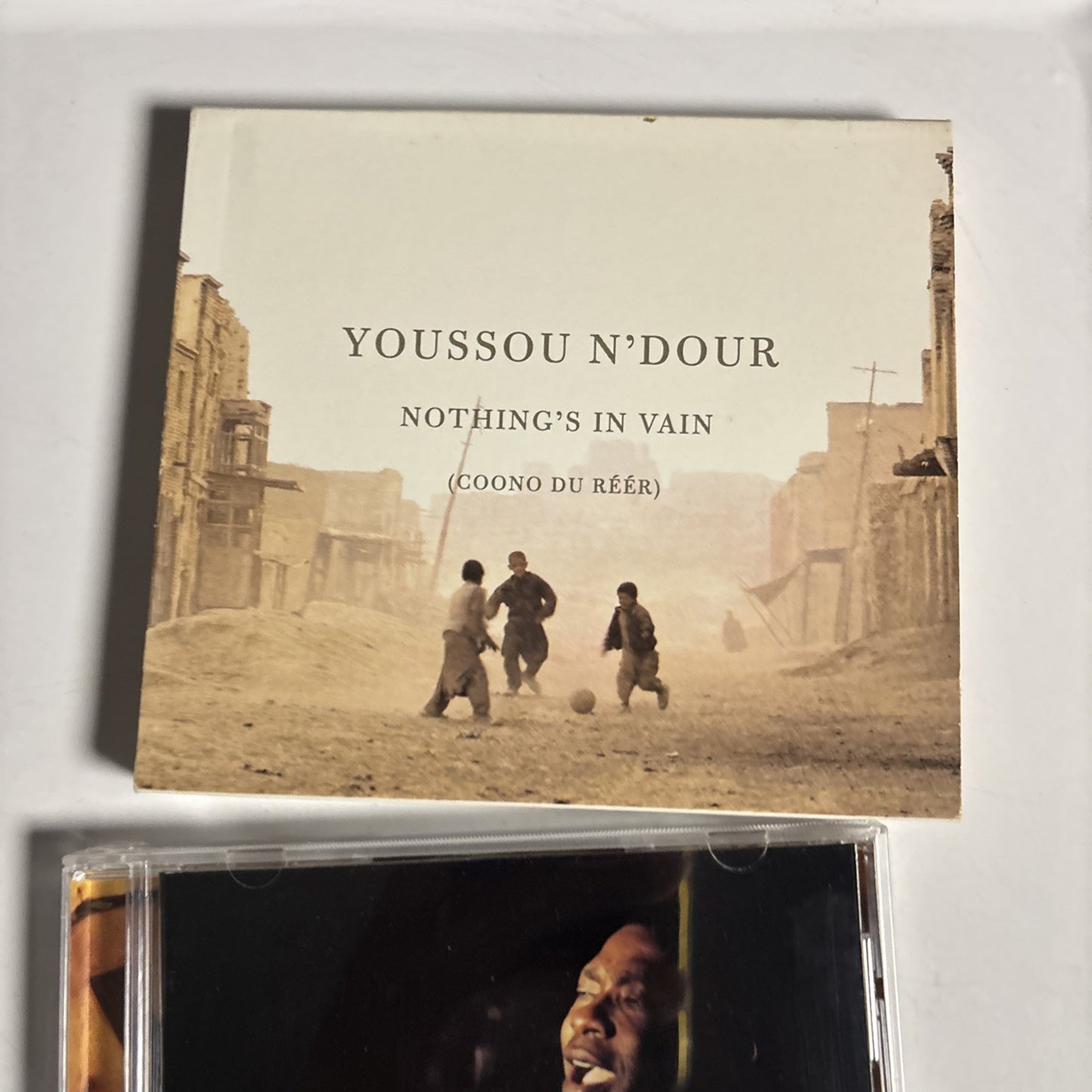 Youssou N'Dour – Nothing's In Vain (Coono Du Réér) (CD, 2002) US 79654-2