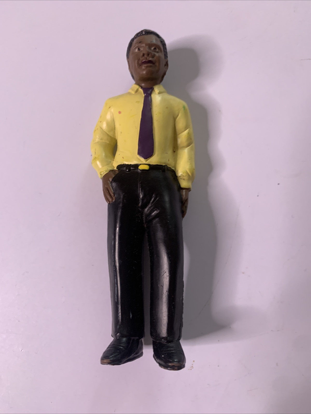 LakeShore 1994 Male Black Figure Yellow Shirt
