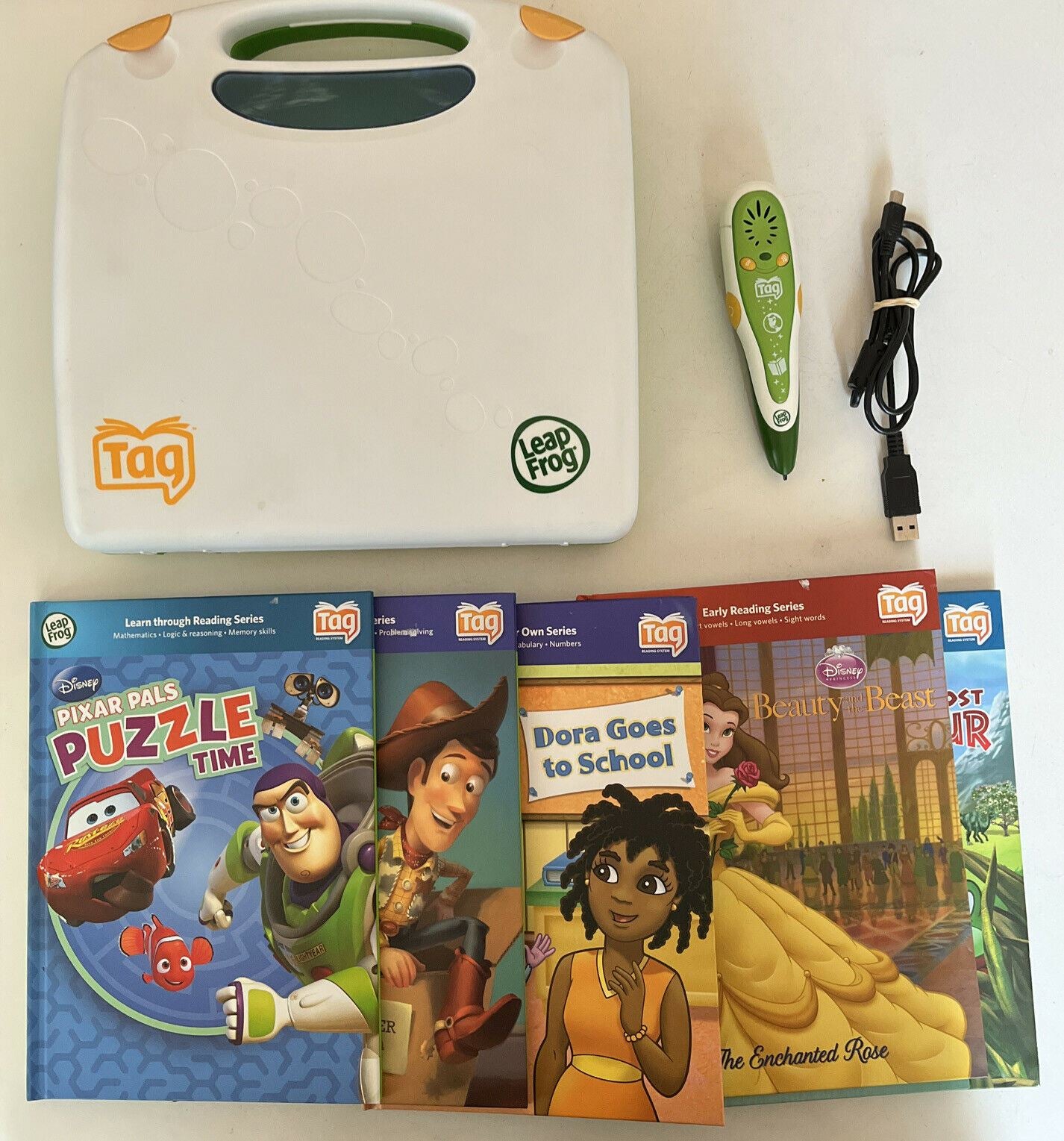 LeapFrog Tag Reading System with Case, 5 Books (Toy Story, Cars, Dora) and pen.