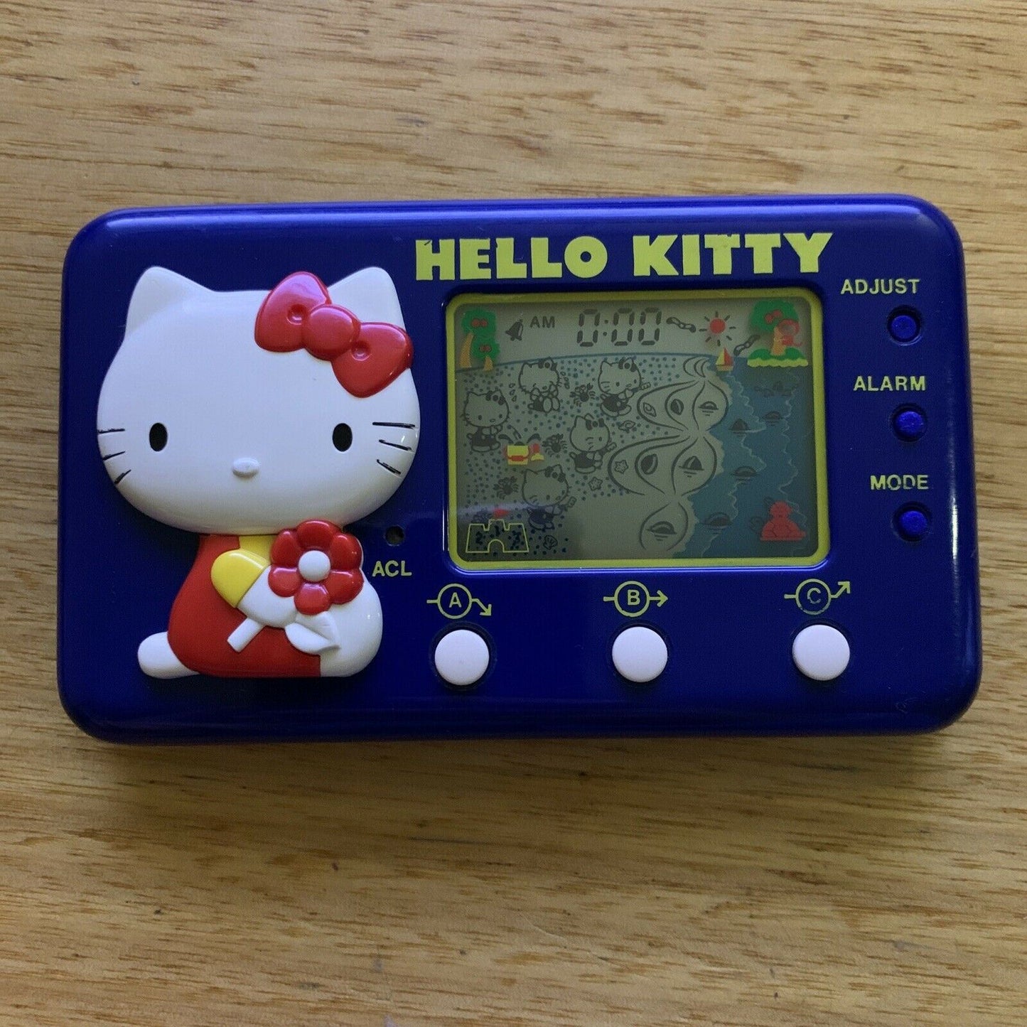 Vintage TOMY Hello Kitty Seaside Holiday LCD Electronic Handheld Game 1982