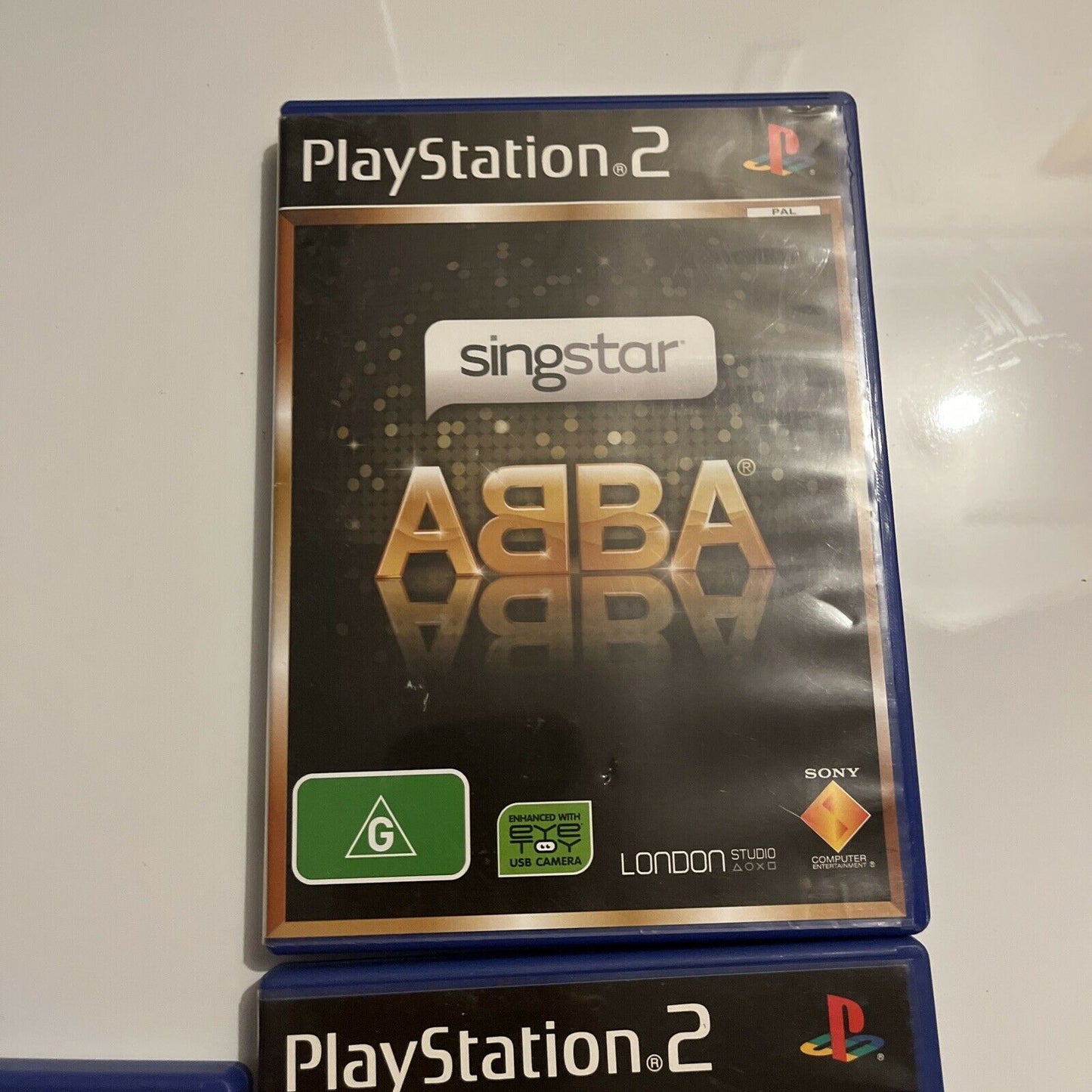 2x SingStar Microphones + 4 SingStar PS2 Games PAL: Anthems, ABBA, Pop, 80's