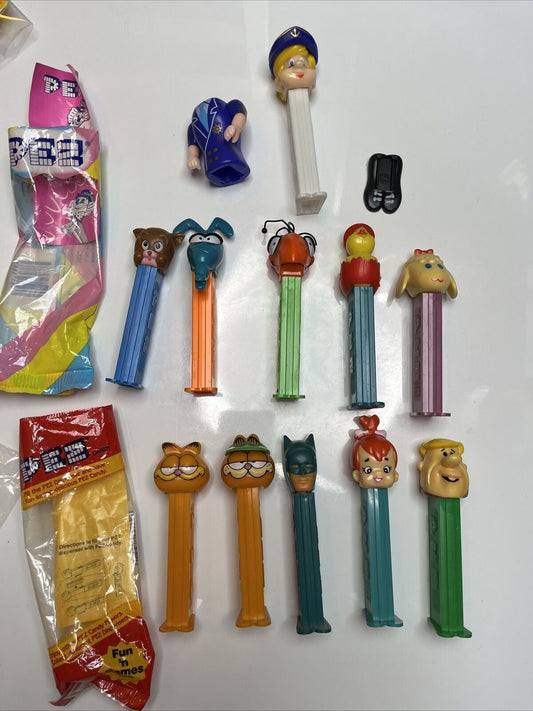 11x Pez Dispensers: Garfield, Batman, Barney, Pebbles, Tyke, The Ant & Aardvark