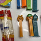 11x Pez Dispensers: Garfield, Batman, Barney, Pebbles, Tyke, The Ant & Aardvark