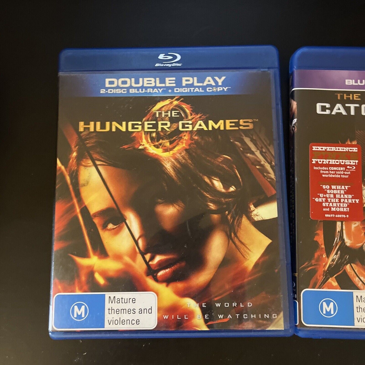 The Hunger Games / The Hunger Games Catching Fire (Blu-ray, 4-Disc) Region B
