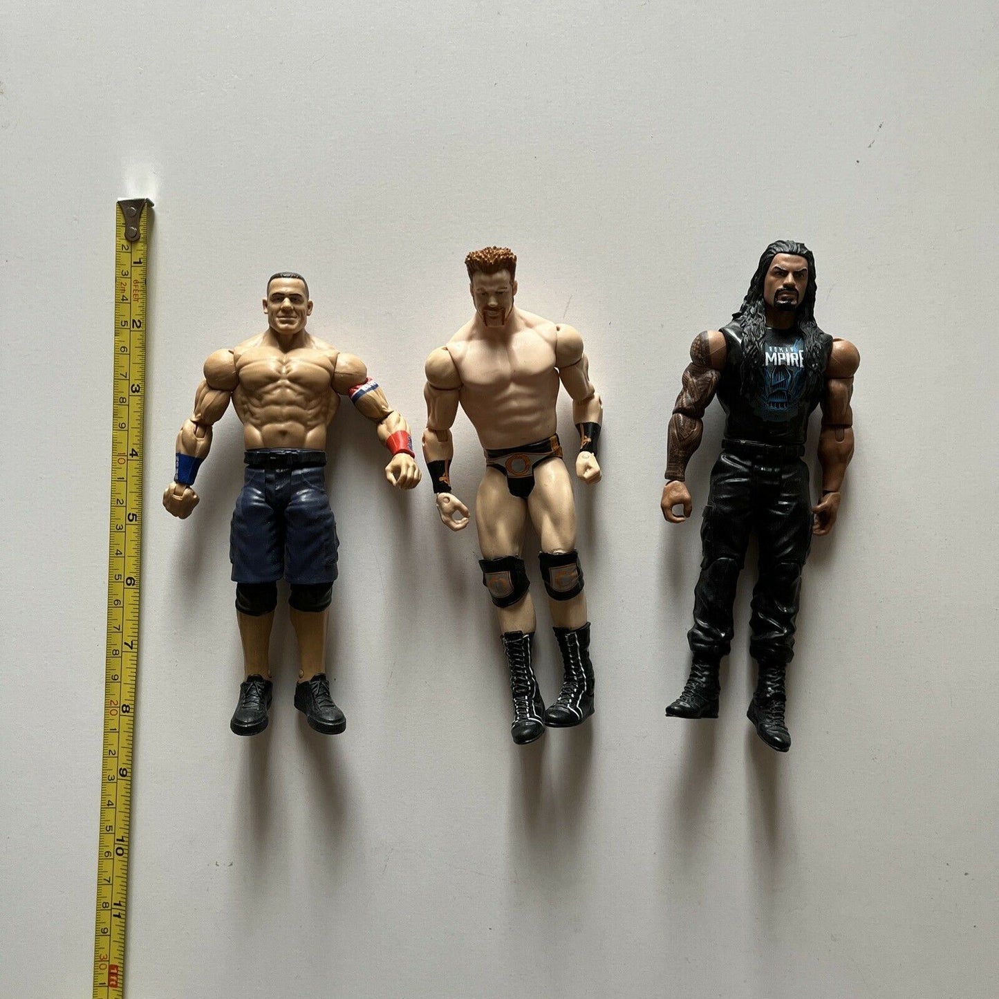 5 WWE Action Figures: The Rock, Sheamus, Roman Reigns, Triple H, John Cena