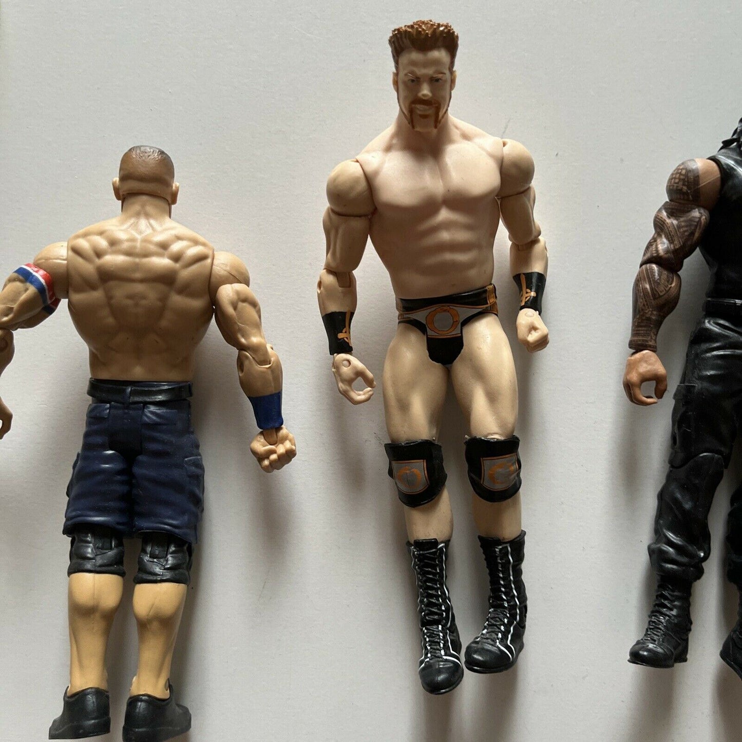 5 WWE Action Figures: The Rock, Sheamus, Roman Reigns, Triple H, John Cena