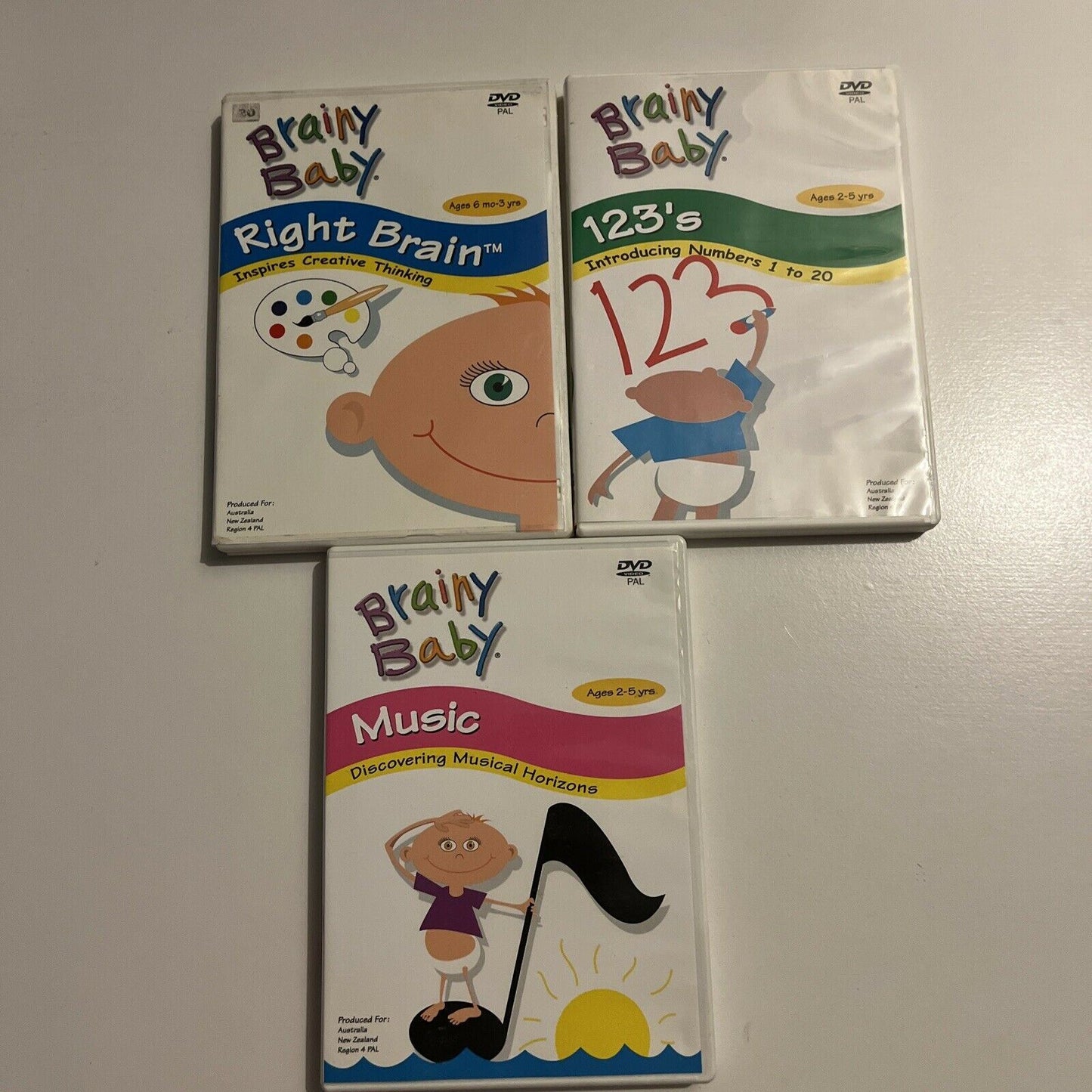 3x Brainy Baby DVDs: Right Brain / 123's / Music. Region 4