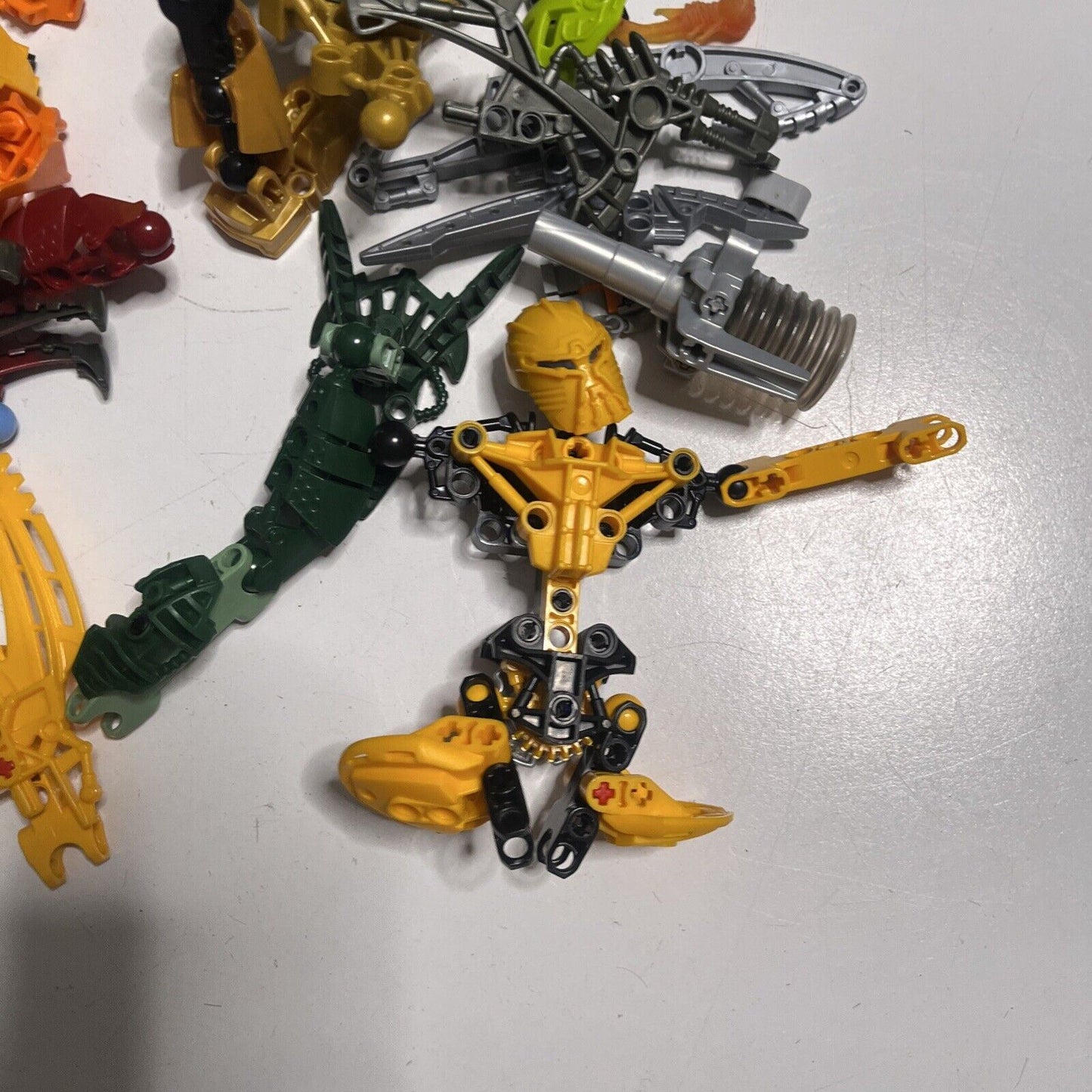 Lego Bionicle  515grams Assorted Characters Weapons and Pieces