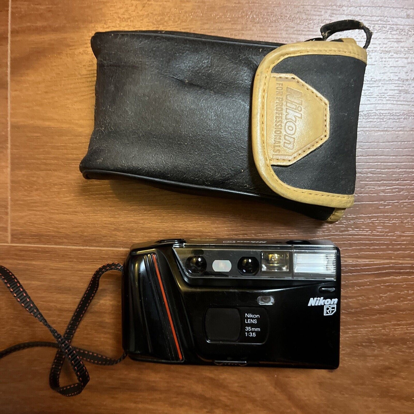 Nikon RF 35mm Film Camera *Works but has broken battery lid*