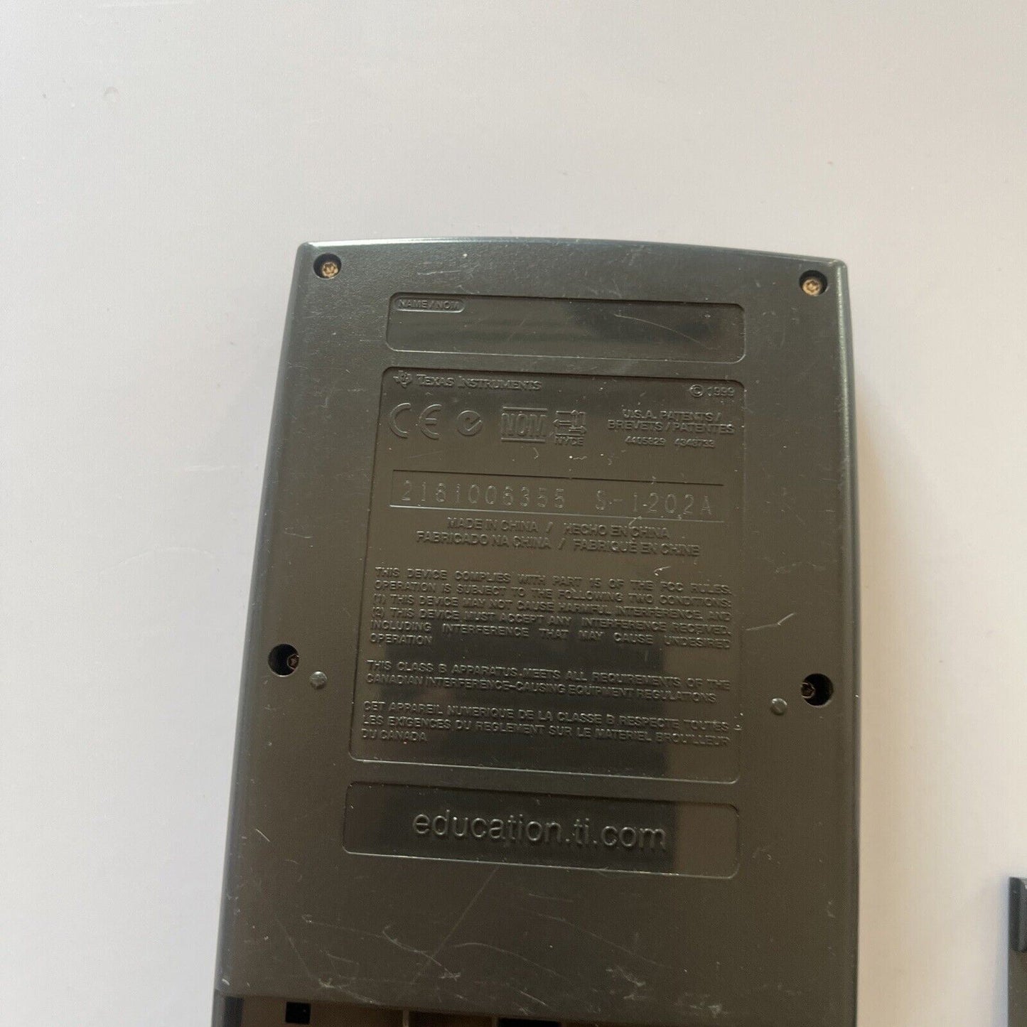 Texas Instruments TI-83 Graphing Calculator With Cover